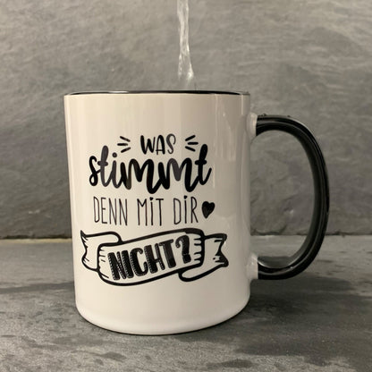 Tasse „Was stimmt denn mit Dir nicht“ Schwarz/Weiß