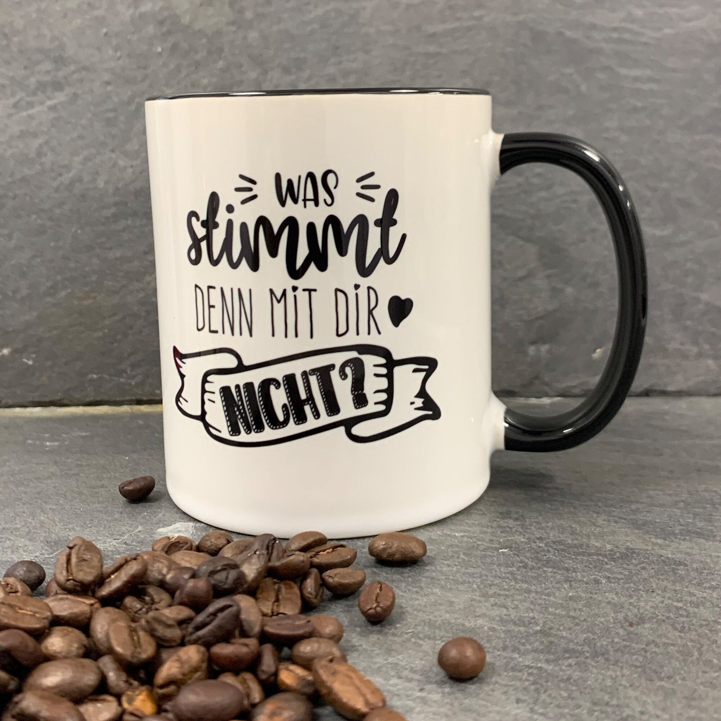Tasse „Was stimmt denn mit Dir nicht“ Schwarz/Weiß