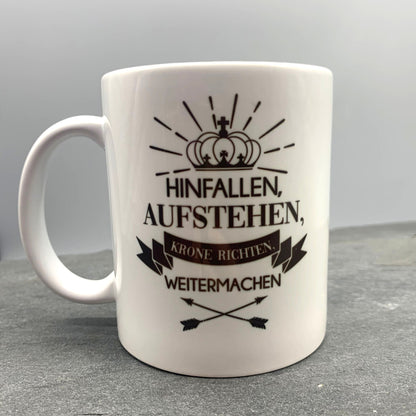 Tasse mit Spruch "Hinfallen, Aufstehen, Krone richten weitermachen" Kaffeetasse